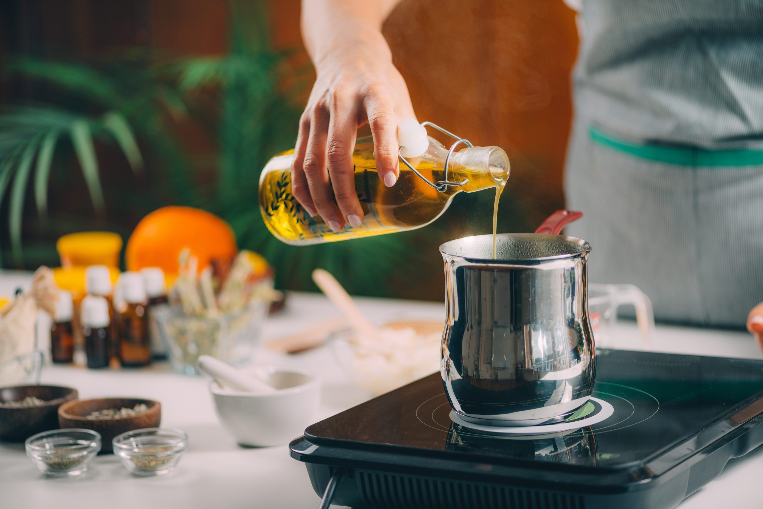 pouring natural oil making homemade soap scaled - تجربة طهي مميزة بإستخدام جالون زيت قلي الطباخ السعيد